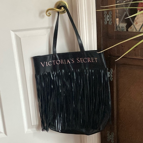 VICTORIA’S SECRET Handbags - VICTORIA’S SECRET black tote bag with 16“ long fringe on vinyl. $15